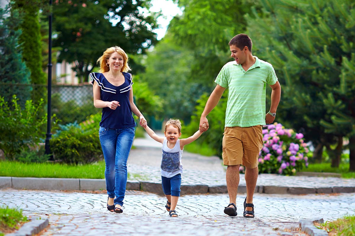 A happy family walking in one of our managed communities in maryland.